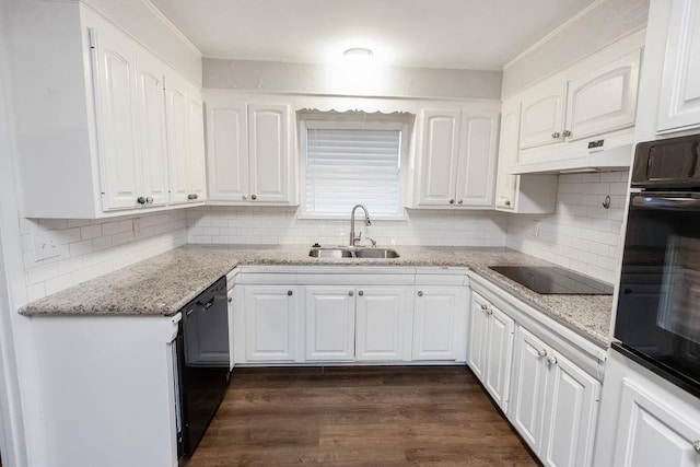 kitchen with sink, white cabinetry, light stone countertops, and black appliances