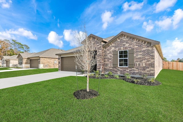 view of front of home with a front yard and a garage