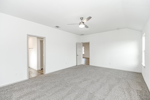 spare room with ceiling fan, carpet floors, and lofted ceiling