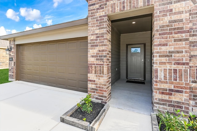 entrance to property featuring a garage