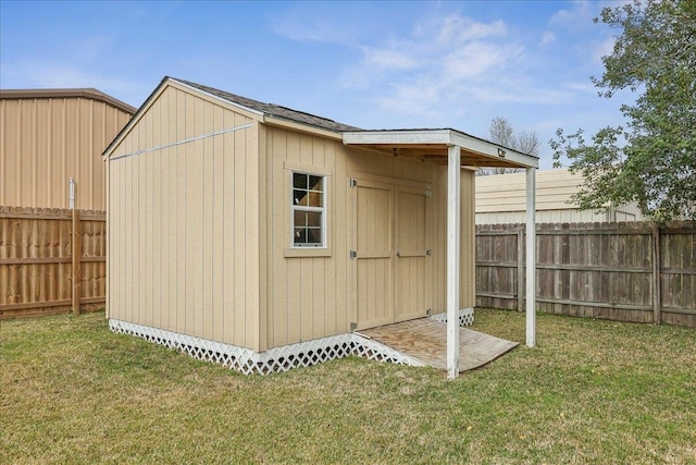 view of shed with a fenced backyard