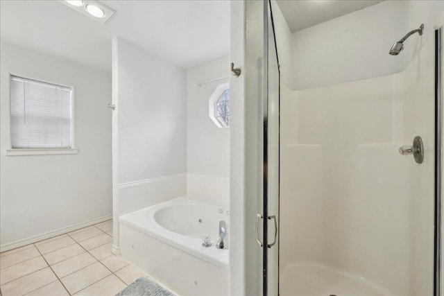 full bath with a stall shower, tile patterned flooring, a tub with jets, and baseboards