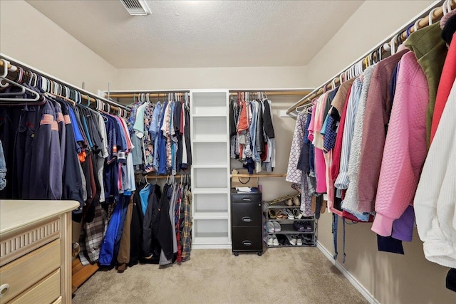 spacious closet with carpet and visible vents