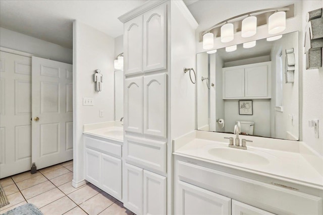 full bath featuring tile patterned flooring, vanity, and toilet