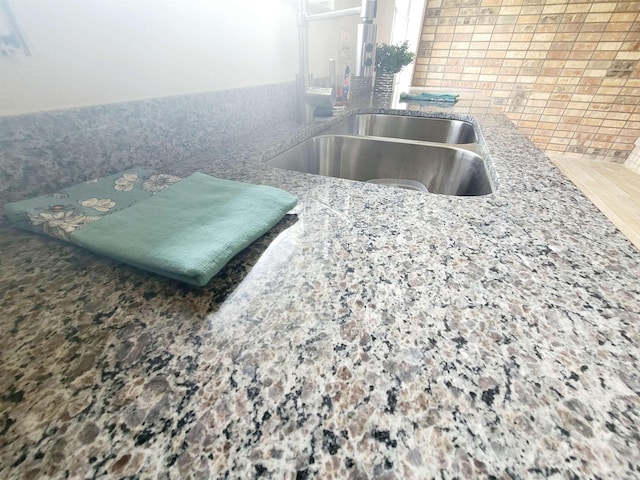 4410 Fortune Ln, Beaumont, TX 77705 - kitchen view of a sink and light stone counters