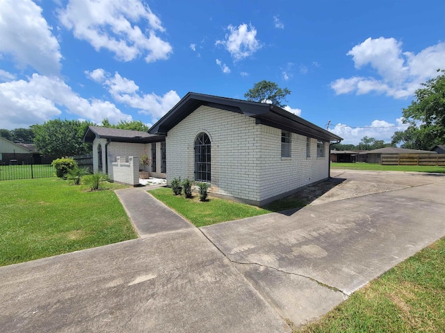 4410 Fortune Ln, Beaumont, TX 77705 - ranch-style house featuring brick siding and driveway