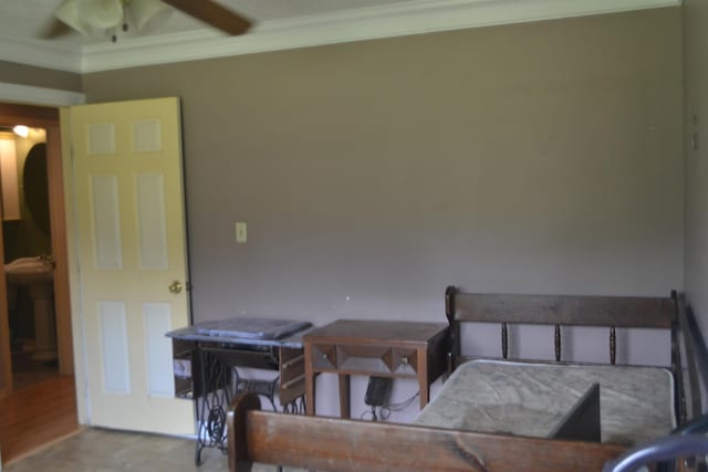 bedroom featuring ceiling fan and crown molding