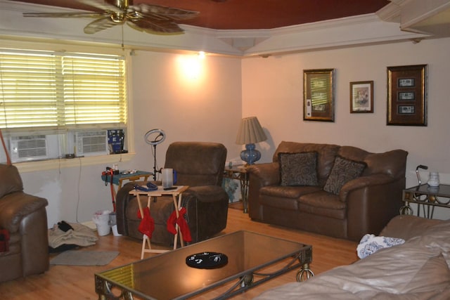 living room with ceiling fan, crown molding, and light hardwood / wood-style flooring