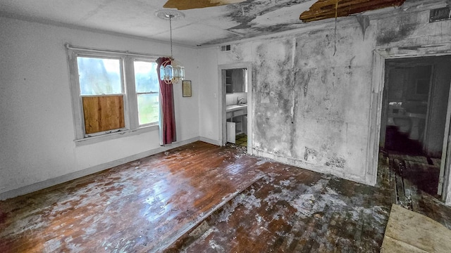 unfurnished dining area with an inviting chandelier