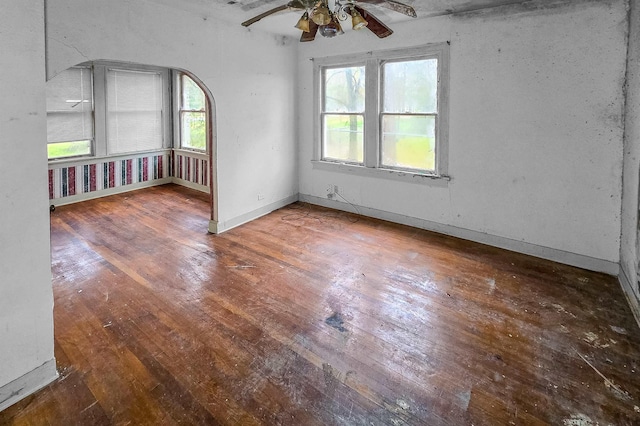 spare room featuring ceiling fan and dark hardwood / wood-style flooring