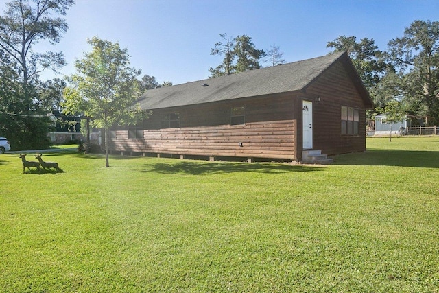 view of side of home featuring a lawn