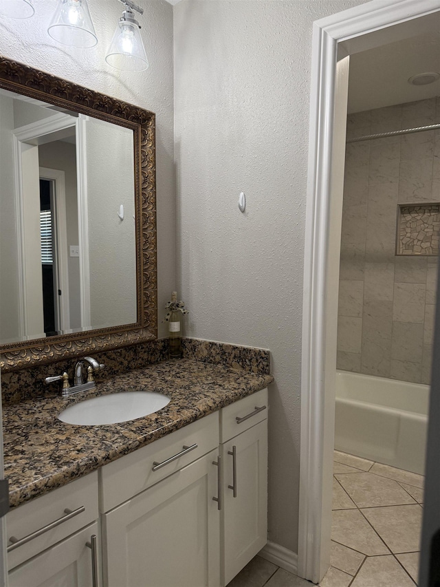 5835 Calder Ave, Beaumont, TX 77706 - full bathroom featuring tile patterned floors, vanity, and bathtub / shower combination