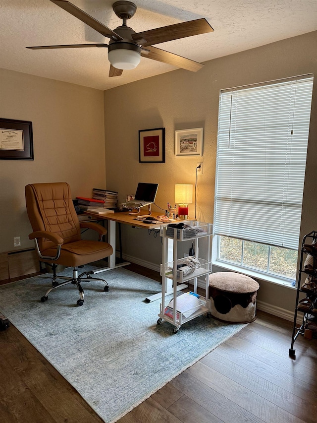 office with baseboards, a textured ceiling, ceiling fan, and wood finished floors