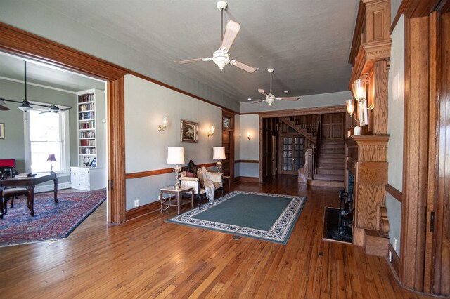 2108 Harrison Ave, Beaumont, TX 77701 - living area with a ceiling fan, stairway, and hardwood / wood-style floors