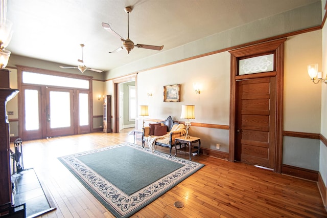 entrance foyer with ceiling fan and light hardwood / wood-style flooring