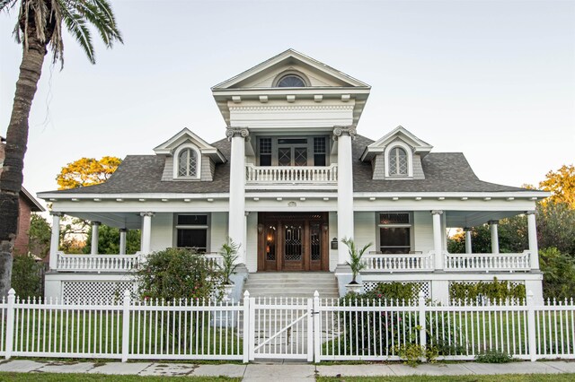 2108 Harrison Ave, Beaumont, TX 77701 - greek revival inspired property with a porch, a shingled roof, a gate, and a fenced front yard