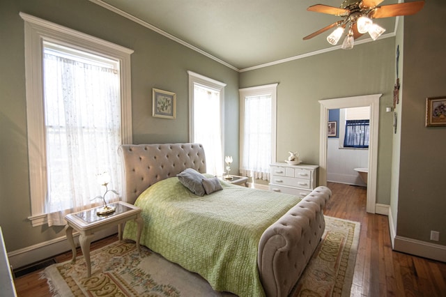 bedroom with multiple windows, ceiling fan, crown molding, and wood-type flooring