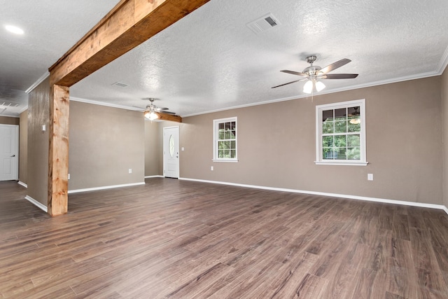 unfurnished living room with ceiling fan, dark wood-type flooring, and ornamental molding