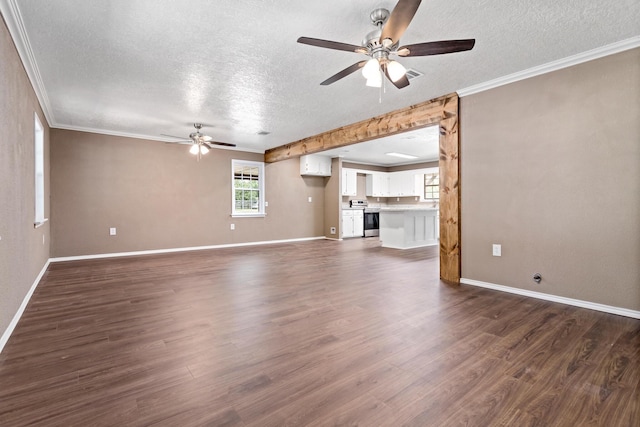 unfurnished living room with a textured ceiling, crown molding, and dark wood-type flooring