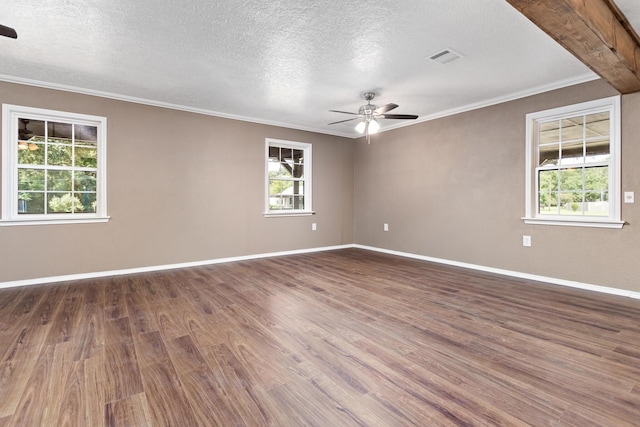 spare room with a textured ceiling, dark hardwood / wood-style flooring, ceiling fan, and ornamental molding