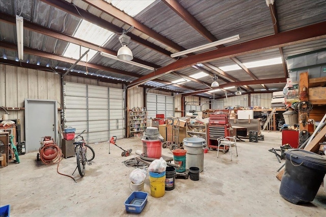 2432 Wespine Dr, Beaumont, TX 77707 - garage featuring a workshop area and a garage door opener