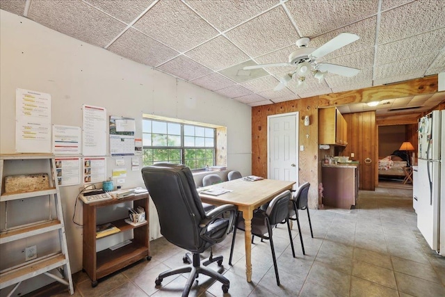 2432 Wespine Dr, Beaumont, TX 77707 - dining space with a ceiling fan, a paneled ceiling, and tile patterned flooring