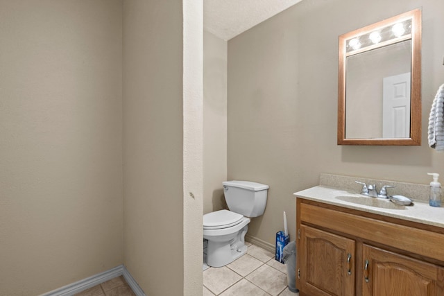 5434 Airline Rd, Silsbee, TX 77656 - bathroom featuring tile patterned floors, toilet, vanity, and baseboards