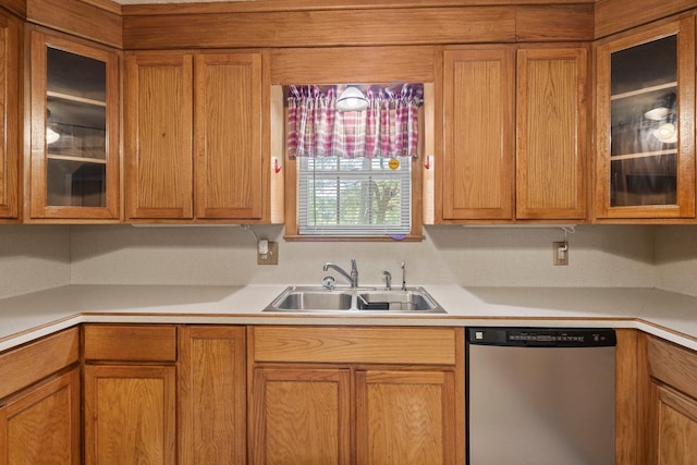 5434 Airline Rd, Silsbee, TX 77656 - kitchen featuring stainless steel dishwasher, a sink, light countertops, and glass insert cabinets