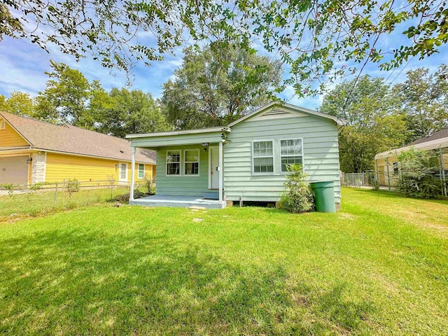 5070 Wilshire Dr, Beaumont, TX 77703 - back of house featuring a porch