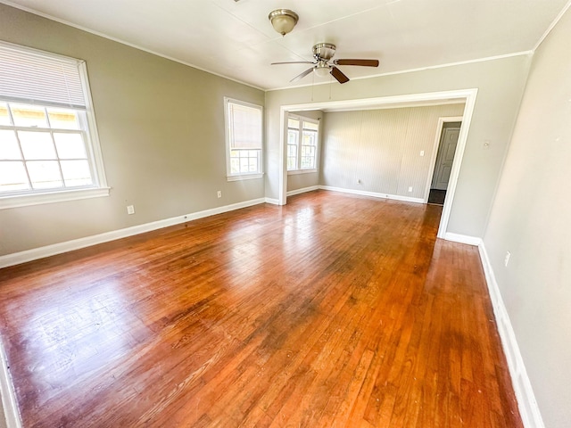 5070 Wilshire Dr, Beaumont, TX 77703 - unfurnished room with ceiling fan, plenty of natural light, ornamental molding, and hardwood / wood-style flooring