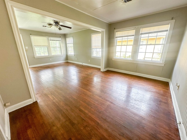 unfurnished room with hardwood / wood-style flooring, ceiling fan, and crown molding