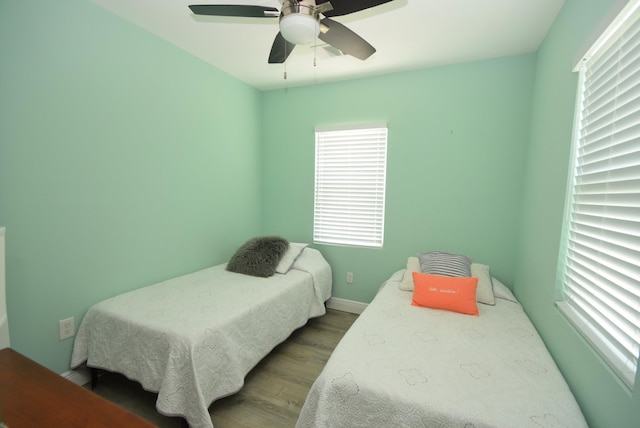 bedroom featuring ceiling fan and hardwood / wood-style floors