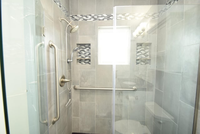 bathroom featuring an enclosed shower