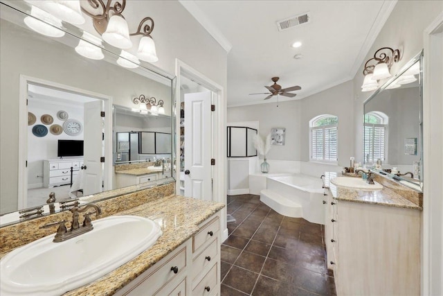 8185 Dawn Dr, Beaumont, TX 77705 - bathroom featuring ornamental molding, a garden tub, ceiling fan, two vanities, and tile patterned floors