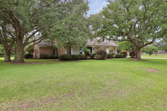 8185 Dawn Dr, Beaumont, TX 77705 - view of front of house with a front lawn