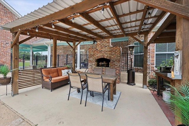 8185 Dawn Dr, Beaumont, TX 77705 - view of patio / terrace featuring an outdoor living space with a fireplace and outdoor dining space