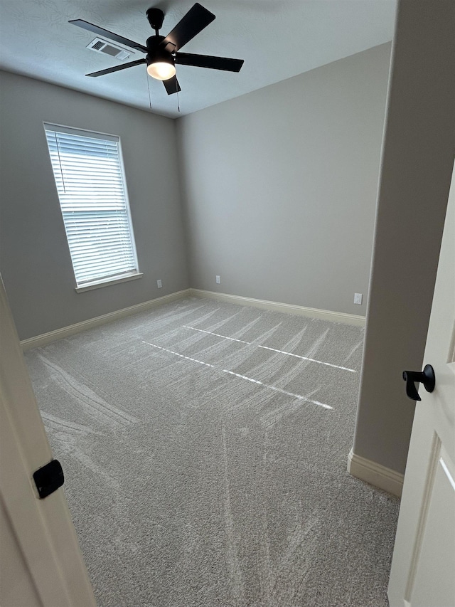 carpeted empty room with ceiling fan