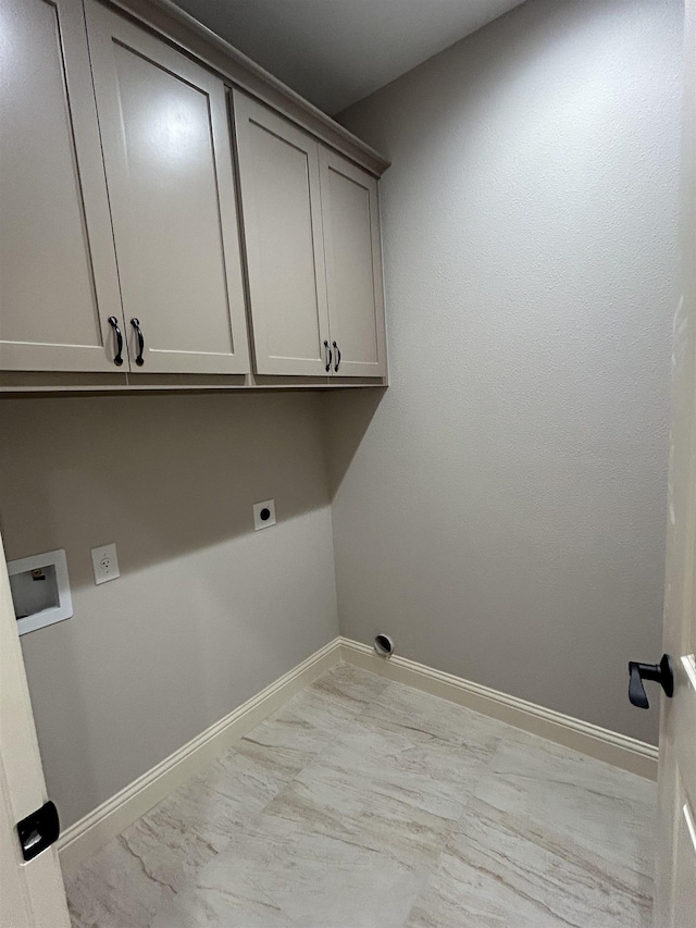 clothes washing area featuring washer hookup, electric dryer hookup, and cabinets