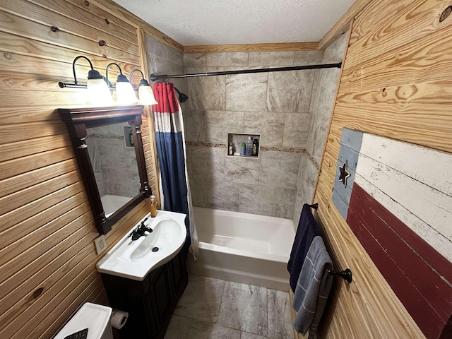 104 Hornbeam Dr, Village Mills, TX 77663 - full bathroom with shower / bath combination with curtain, vanity, a textured ceiling, and wooden walls