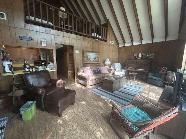 104 Hornbeam Dr, Village Mills, TX 77663 - living area featuring wooden walls, wood finished floors, beamed ceiling, and high vaulted ceiling