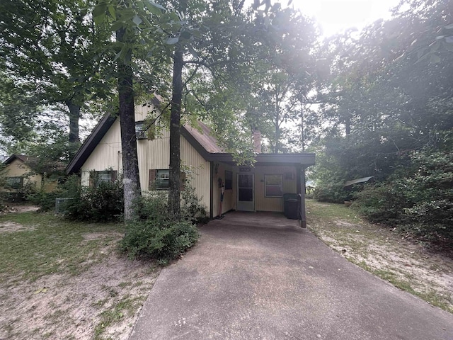 104 Hornbeam Dr, Village Mills, TX 77663 - view of front of property with driveway and a carport