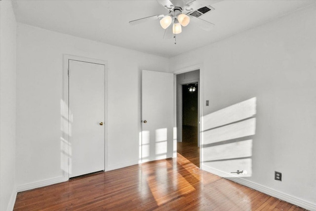 unfurnished bedroom with hardwood / wood-style floors and ceiling fan