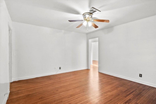 spare room featuring hardwood / wood-style floors and ceiling fan