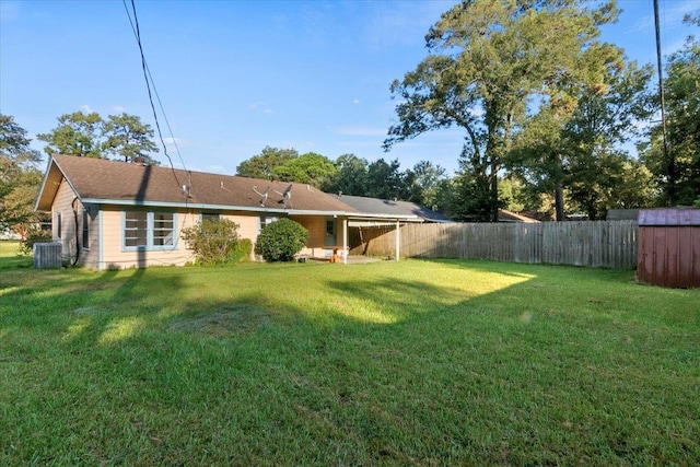 view of yard featuring central AC