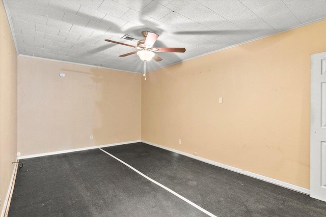 spare room featuring ceiling fan and ornamental molding