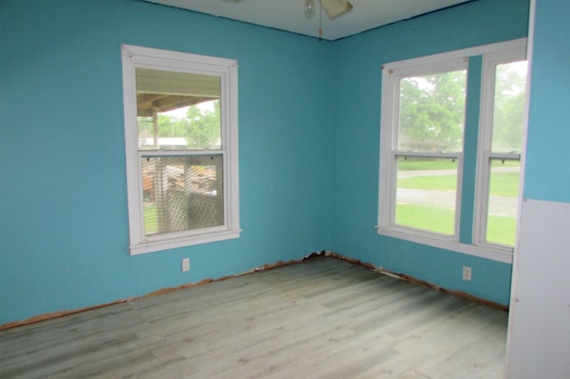 2114 11th St, Port Neches, TX 77651 - empty room with wood finished floors and a ceiling fan