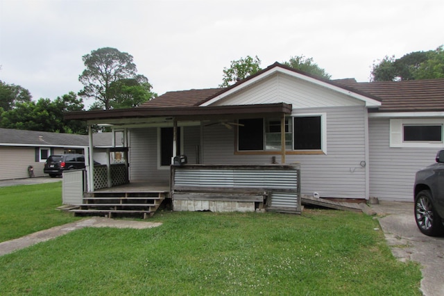 2114 11th St, Port Neches, TX 77651 - view of front of house with a front yard and covered porch