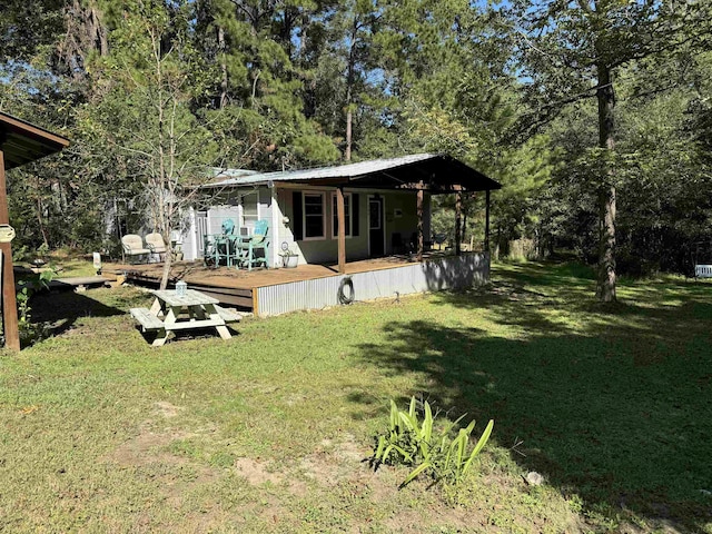 view of yard with a wooden deck