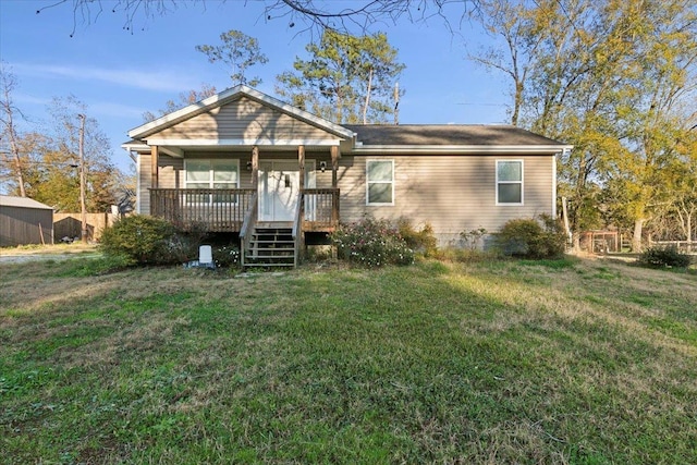 view of front of house with covered porch and a front yard