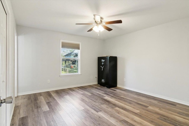 unfurnished room featuring ceiling fan and wood-type flooring